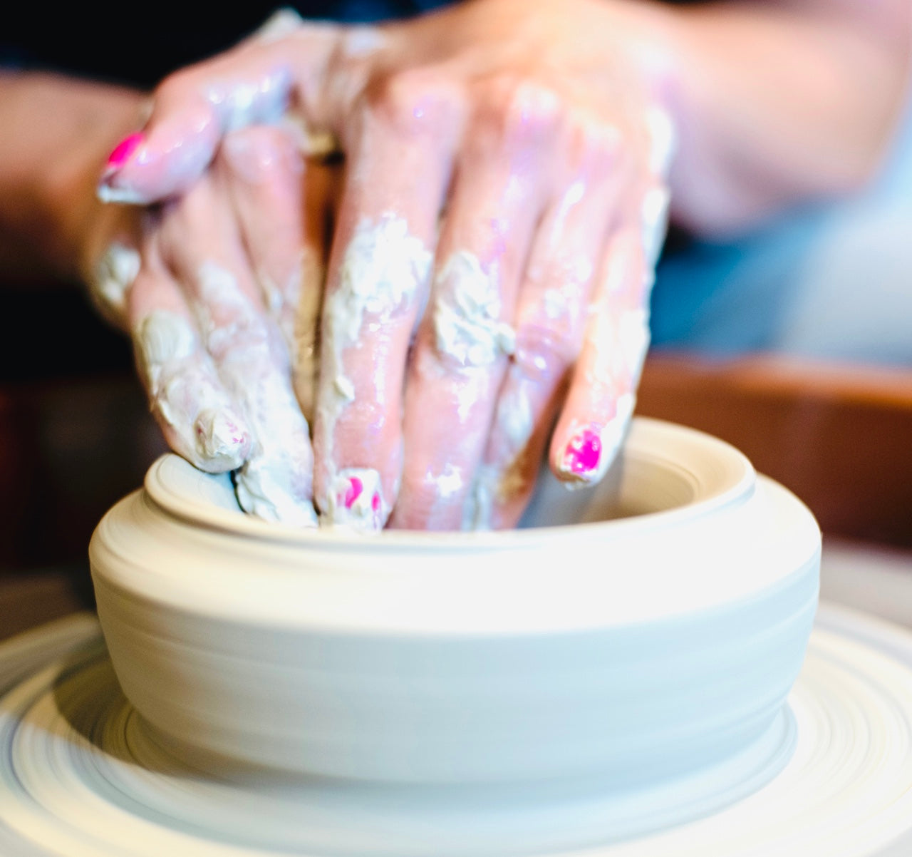 throwing cup on the wheel